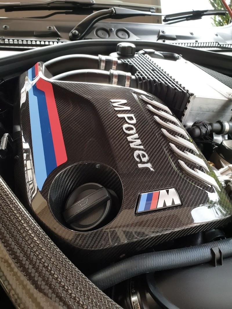 BMW M Power engine bay with carbon fibre engine cover — performance upgrade at V8Hub